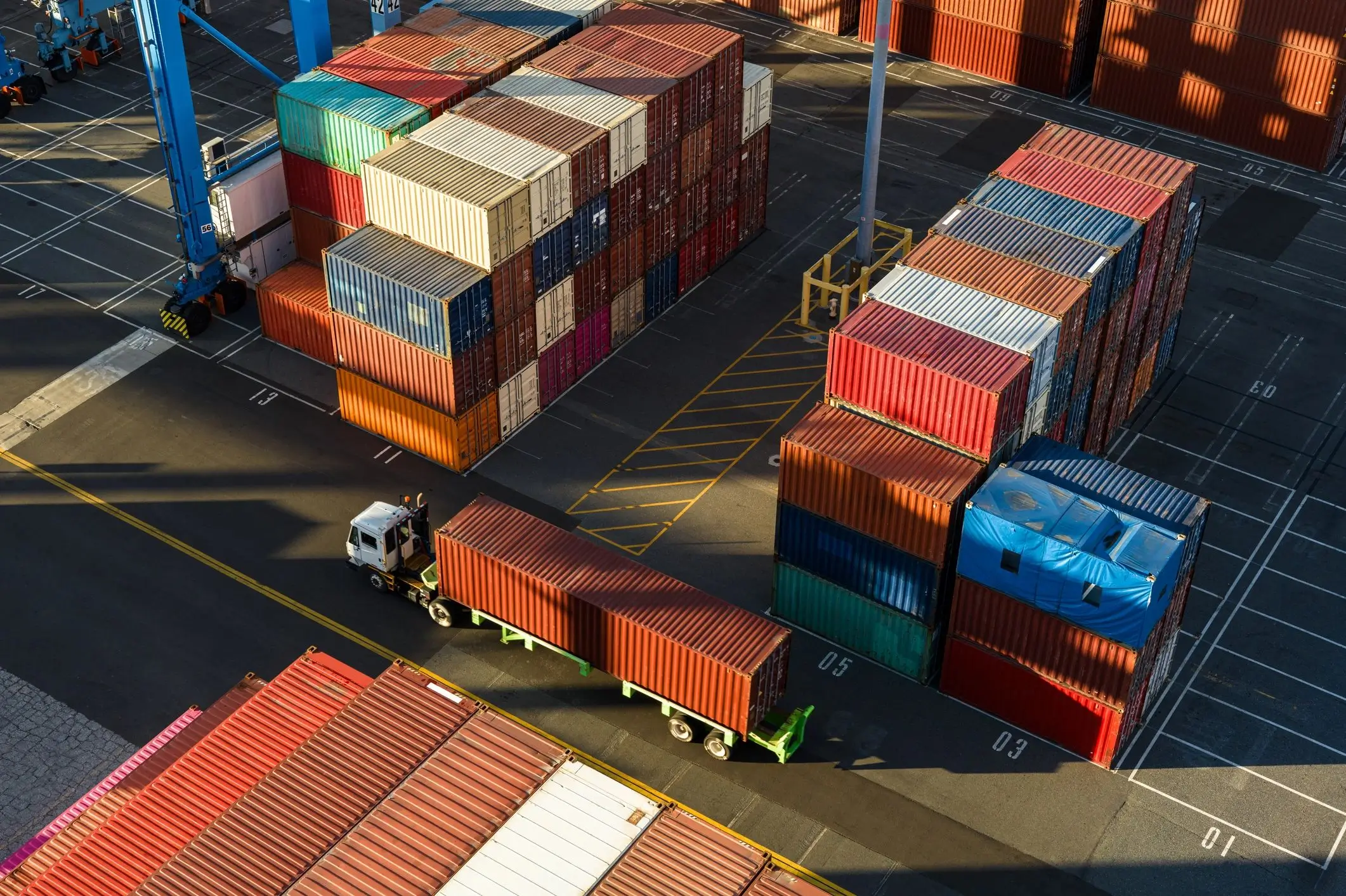 Shipping containers in a busy port terminal.